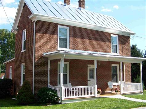 brick houses pics with red metal roofs|metal roofs on brick houses.